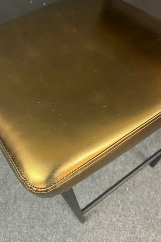 Close up image of the Burnished Gold Roll Back Bar Stool