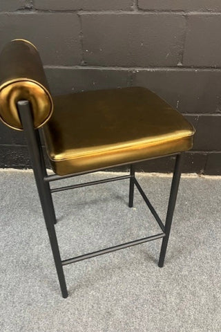 Side view of the Burnished Gold Roll Back Bar Stool