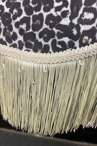 Close-up image of the fringing on the Monochrome Leopard Print Tassel Edge Ceiling Light