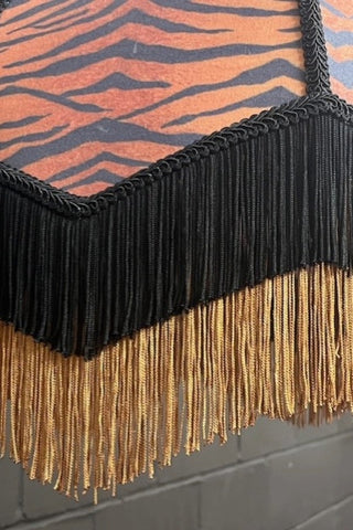 Detail on the fringed tiger print lampshade.