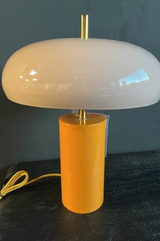 The Pink & Orange Statement Table Lamp against a dark background