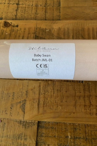 Close up of the label on the Lifestyle image of the Stil Haven Baby Swan Wallpaper