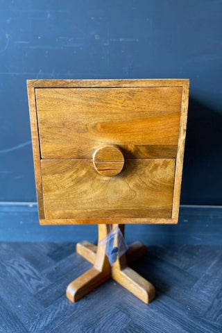 The Brown Wooden Footed Bedside Table against a grey background.