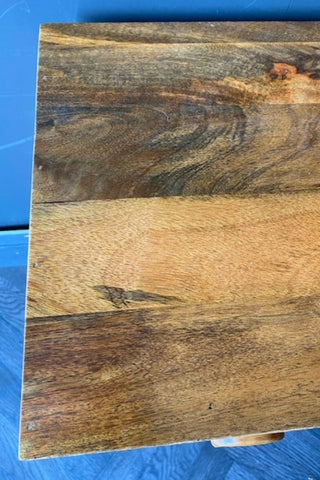 Close up view of the surface of The Brown Wooden Footed Bedside Table.
