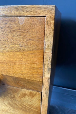 Detail of The Brown Wooden Footed Bedside Table.
