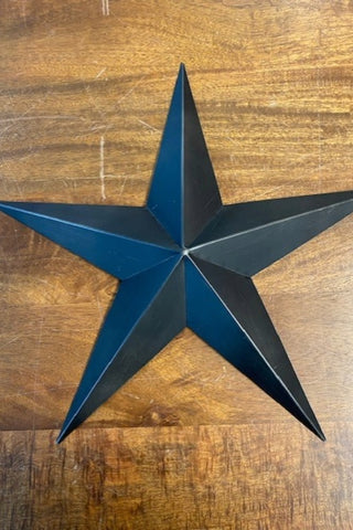 Image of the medium sized star from the Set Of 3 Black Metal Stars on a wooden background