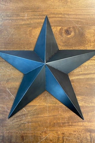 Image of the smallest sized star from the Set Of 3 Black Metal Stars on a wooden background