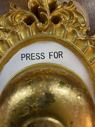 Detail of the Press For Champagne Wall Ornament.
