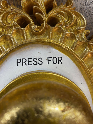 Close up of the lettering on the Press For Champagne Wall Ornament.