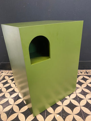 Image of The Green Alcove Wooden Side Table on a geometric floor against a dark wall