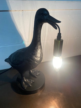 The Duck Table Lamp lit up.