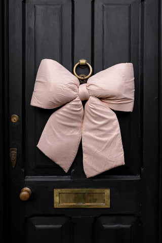 Lifestyle image of the Pink Plush Bow Christmas Decoration