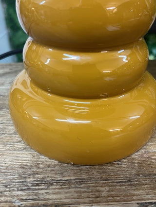 Side view of the slight damage to the mustard lamp.