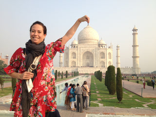 Lucy St George standing in front of the Taj Mahal. 