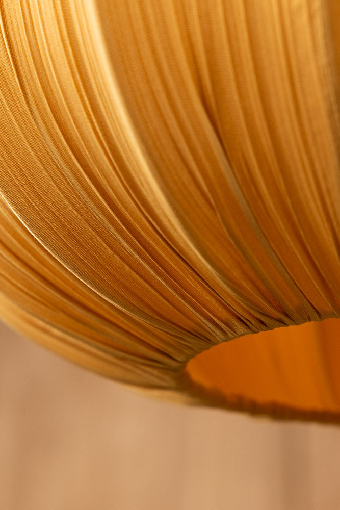 Close-up of the base of the Ochre Pleated Fabric Ceiling Light.