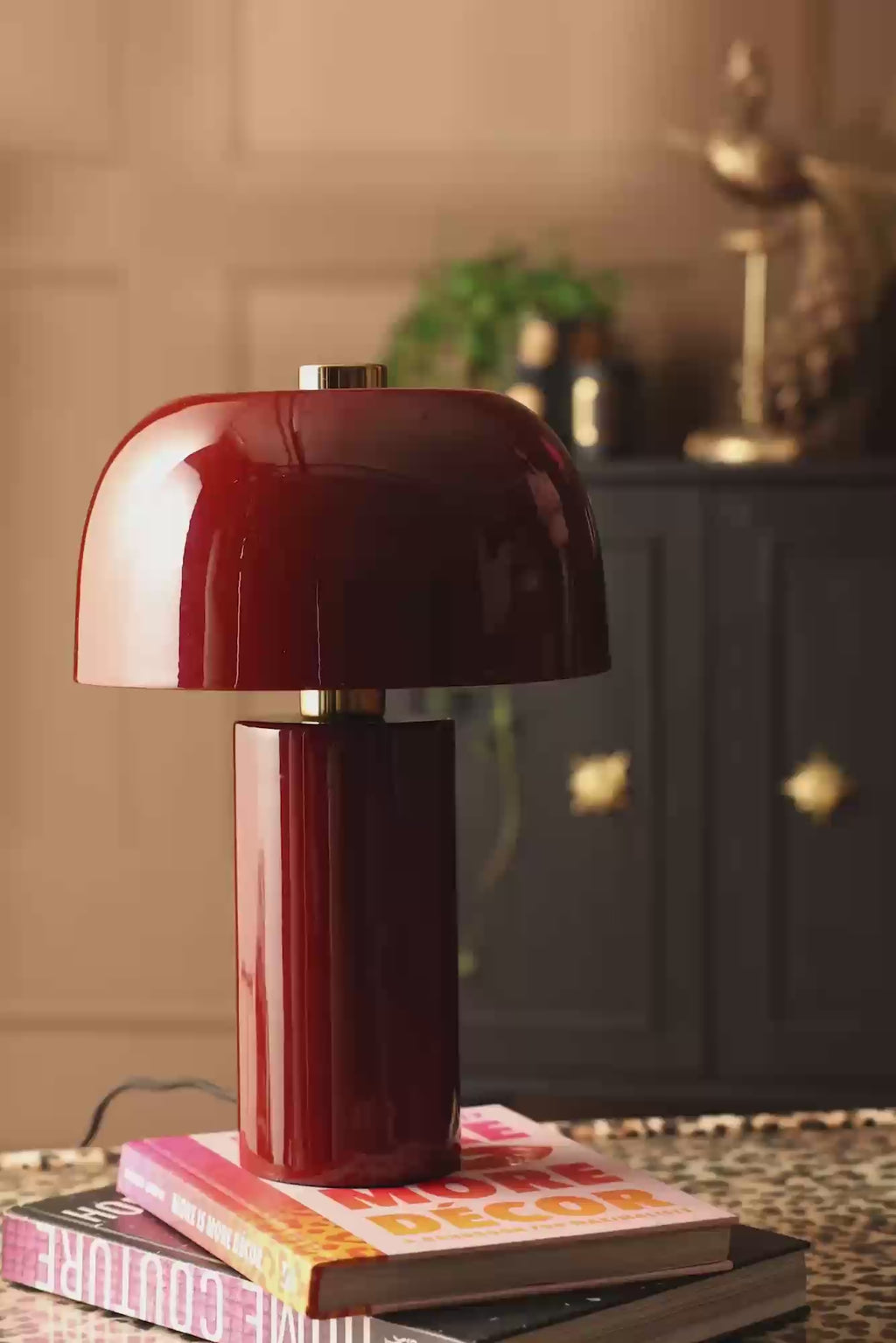Video of someone walking past the Modern Rosso Red Table Lamp and it switching on.
