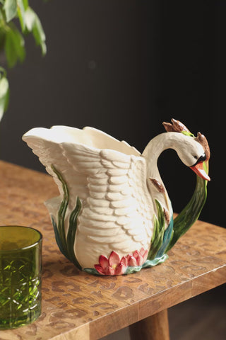 A video of the someone pouring water from the Beautiful Painted Swan Jug.