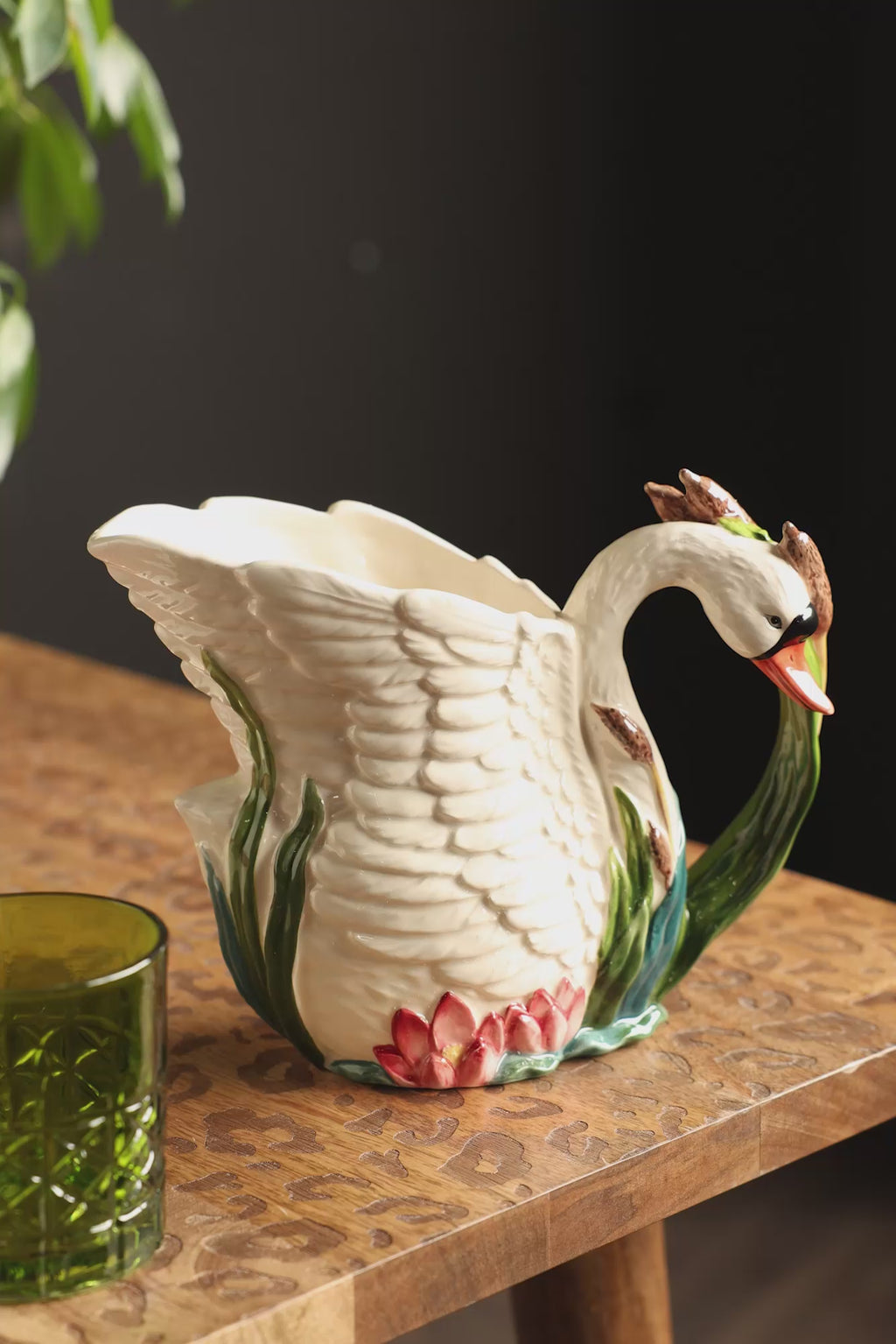 A video of the someone pouring water from the Beautiful Painted Swan Jug.