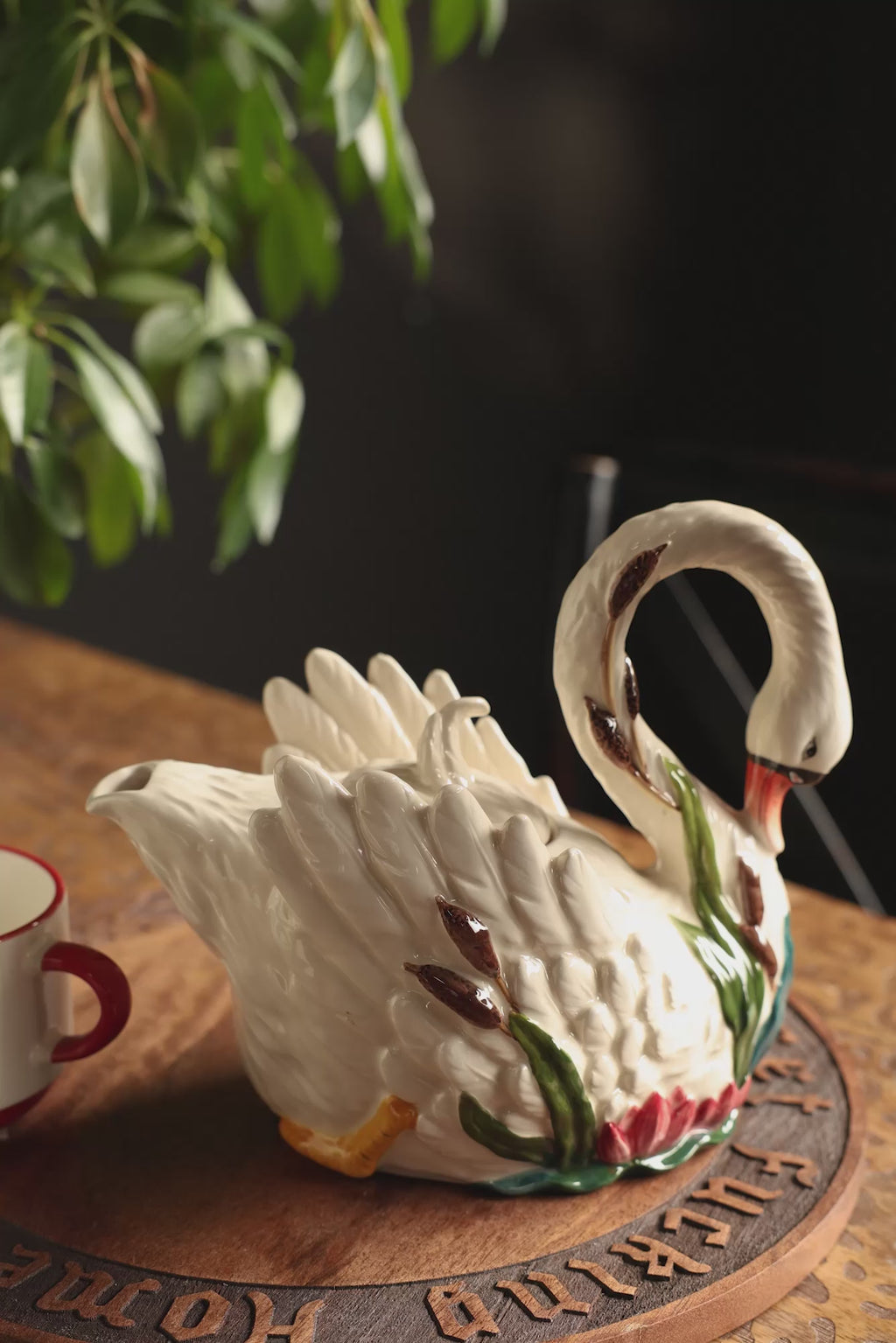 Tea being poured from the Beautiful Painted Swan Teapot.