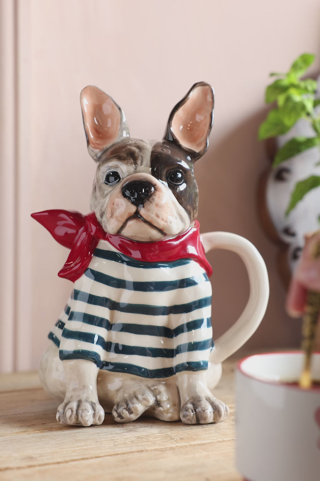 A video of the Quirky French Bulldog Teapot with a tea being stirred in the background.