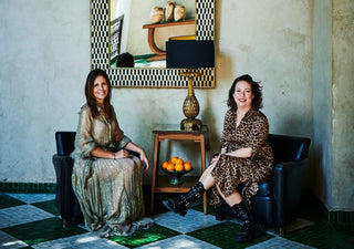 Image showing Rockett St George founders Jane Rockett and Lucy St George sitting on chairs, surrounded by home accessories.