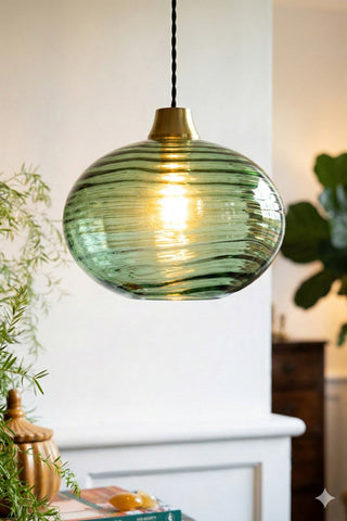 Lifestyle image of the Swirled Glass Easyfit Ceiling Light Shade in Green styled in a light setting