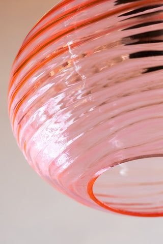 Detail image of the Swirled Glass Easyfit Ceiling Light Shade in Pink against a white wall