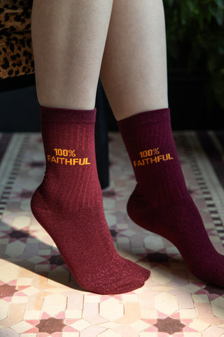 The 100% Faithful Burgundy Glitter Socks shown being worn.  