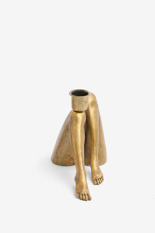 Cutout image of the Sexy Gold Legs Candle Holder on a white background.