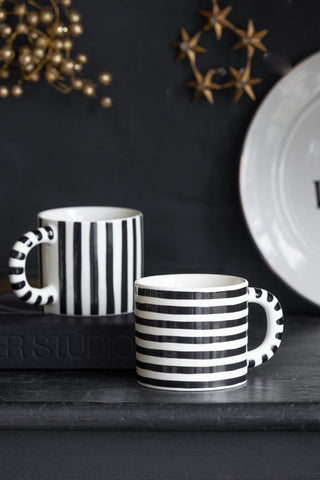 Lifestyle image of the Set Of 2 Monochrome Stripey Mugs