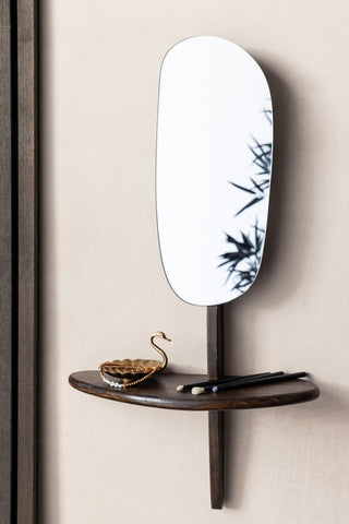 Lifestyle image of the Abstract Walnut Wall Mirror With Shelf