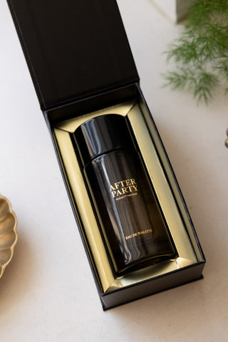 The After Party Eau de Toilette - 100ml inside its box, seen from above on a white surface.
