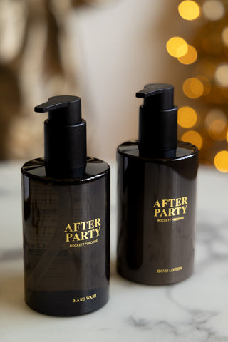The After Party Hand Care Duo Gift Set bottles displayed on a white marble surface.