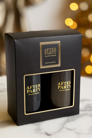 The After Party Hand Care Duo Gift Set in the box, displayed on a white surface with fairy lights in the background.