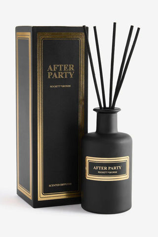 A reed diffuser with the words 'after party' on, with the matching box, on a white background.
