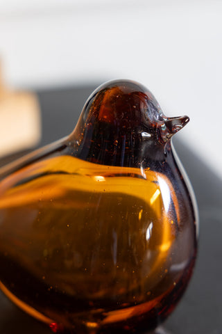 Close-up image of the Amber Glass Bird Ornament