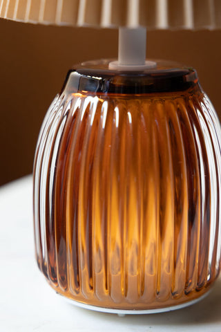 Close-up of the base of the Amber Pleated Rechargeable Table Lamp.