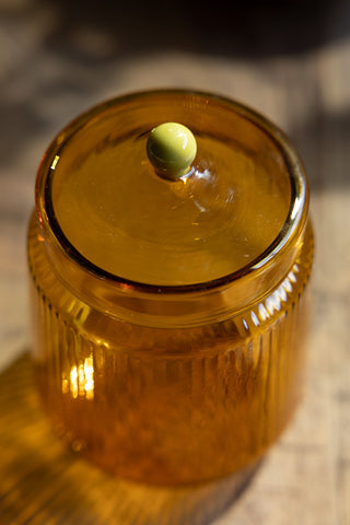 Close-up image of the Amber Ribbed Glass Storage Jar - Short