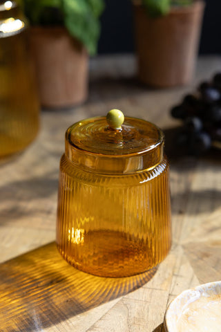 Lifestyle image of the Amber Ribbed Glass Storage Jar - Short