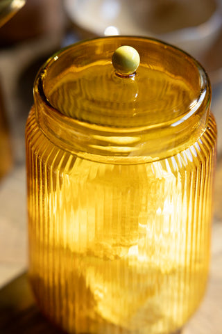 Close-up image of the Amber Ribbed Glass Storage Jar - Tall