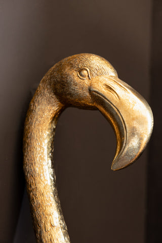 A close up of the face and beak detailing on the Antique Gold Flamingo Head Wall Art
