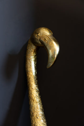 A close up image of Antique Gold Flamingo Head Wall Art.