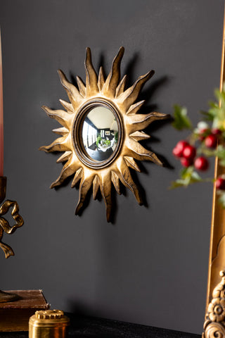 Lifestyle image of the Antique Gold Sun Convex Mirror