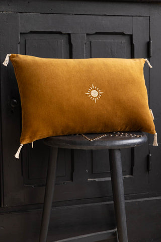 Lifestyle image of the Antique Gold Sunshine Velvet Cushion