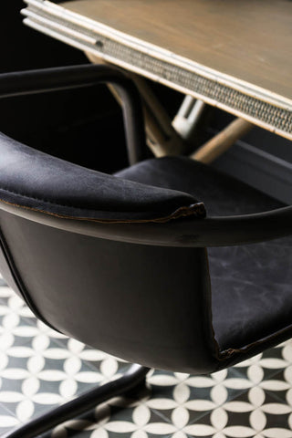 Close-up image of the Antique Slate Leather Chair