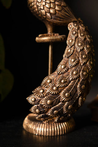 Close-up of the base of the Antique-Style Gold Peacock Ornament.