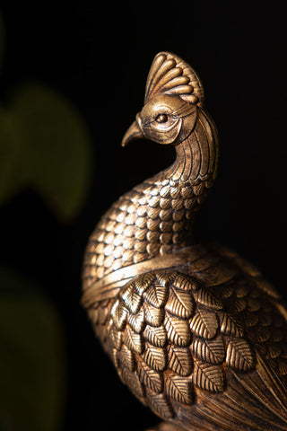 Close-up of the face of the Antique-Style Gold Peacock Ornament.