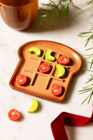 Lifestyle image of the Avocado & Tomato on Toast Noughts & Crosses Game