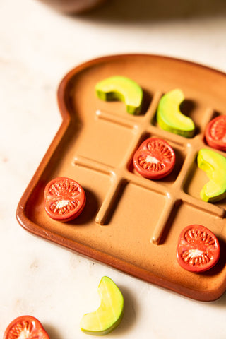 Close-up image of the Avocado & Tomato on Toast Noughts & Crosses Game