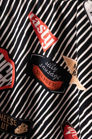 Close-up of the motifs on the Badge Patch Tea Towel.